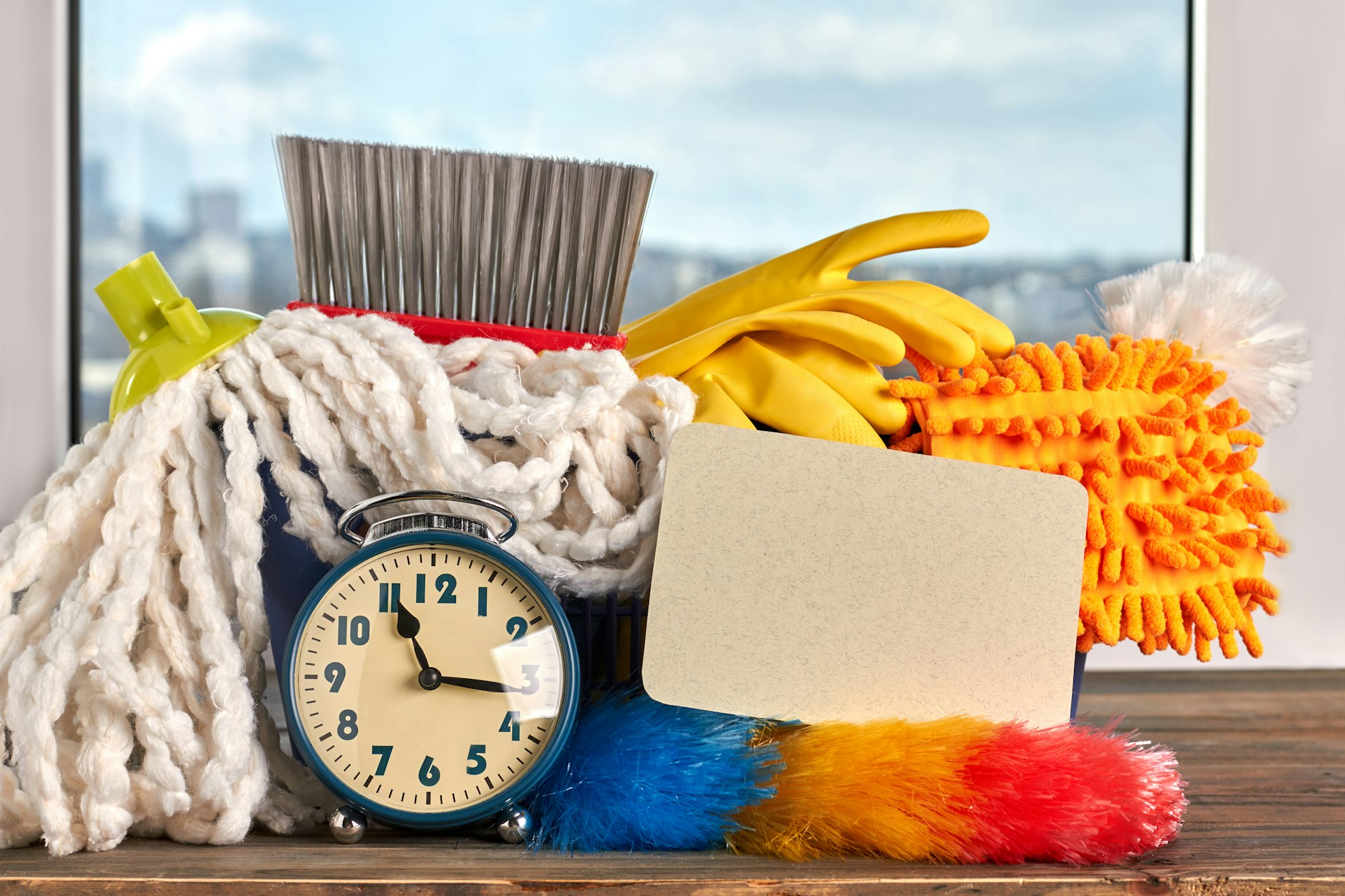 House cleaning items and alarm clock.